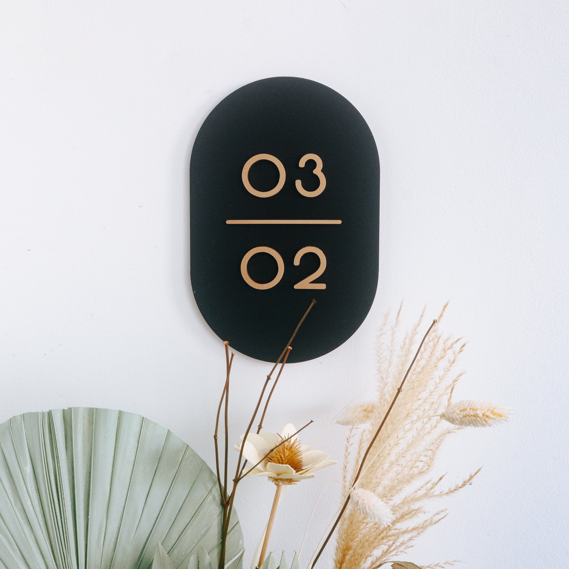 Customised Unit Number Sign in Singapore with matte black acrylic base and matte gold acrylic text