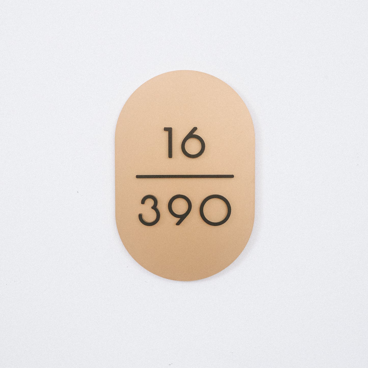 Customised Unit Number Sign in Singapore with matte gold acrylic base and matte black acrylic text