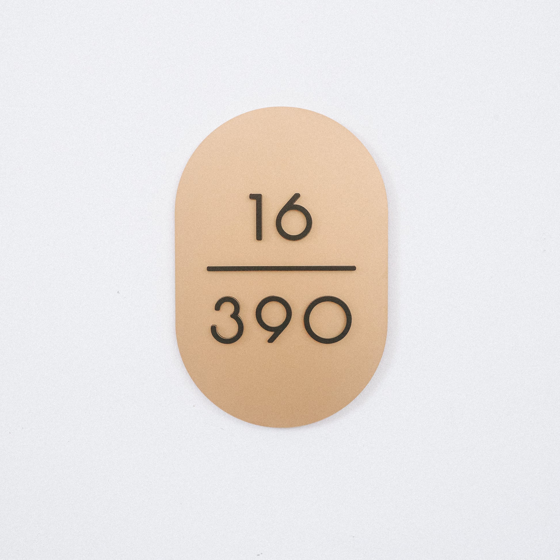 Customised Unit Number Sign in Singapore with matte gold acrylic base and matte black acrylic text
