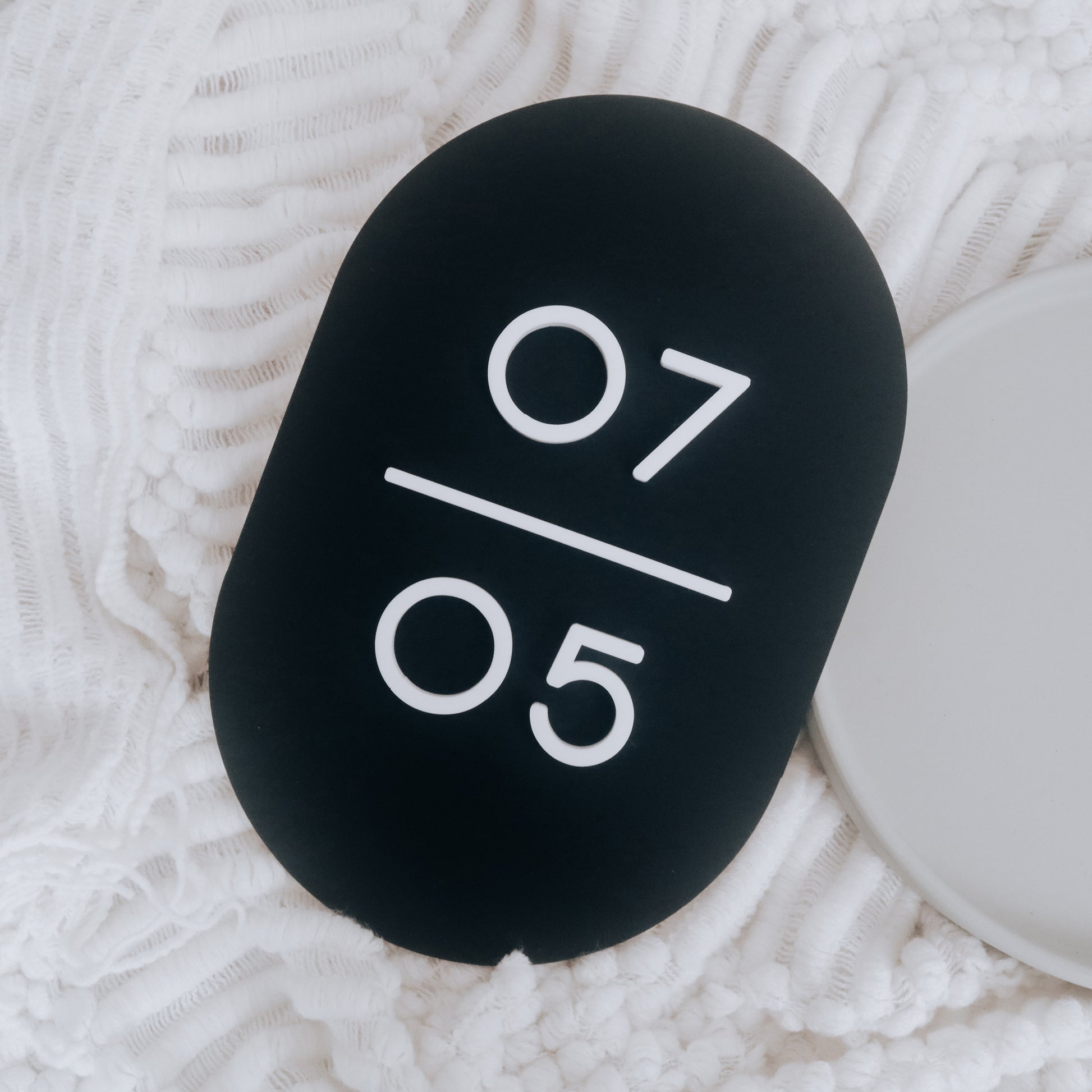 Customised Monochrome Unit Number Sign in Singapore with matte black acrylic base and matte white acrylic text